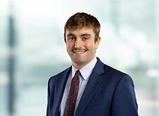 Noah Chase on light blue and white bokeh banner