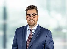 Brandon Bourg on light blue and white bokeh banner