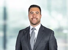 Mario Caito on light blue and white bokeh banner