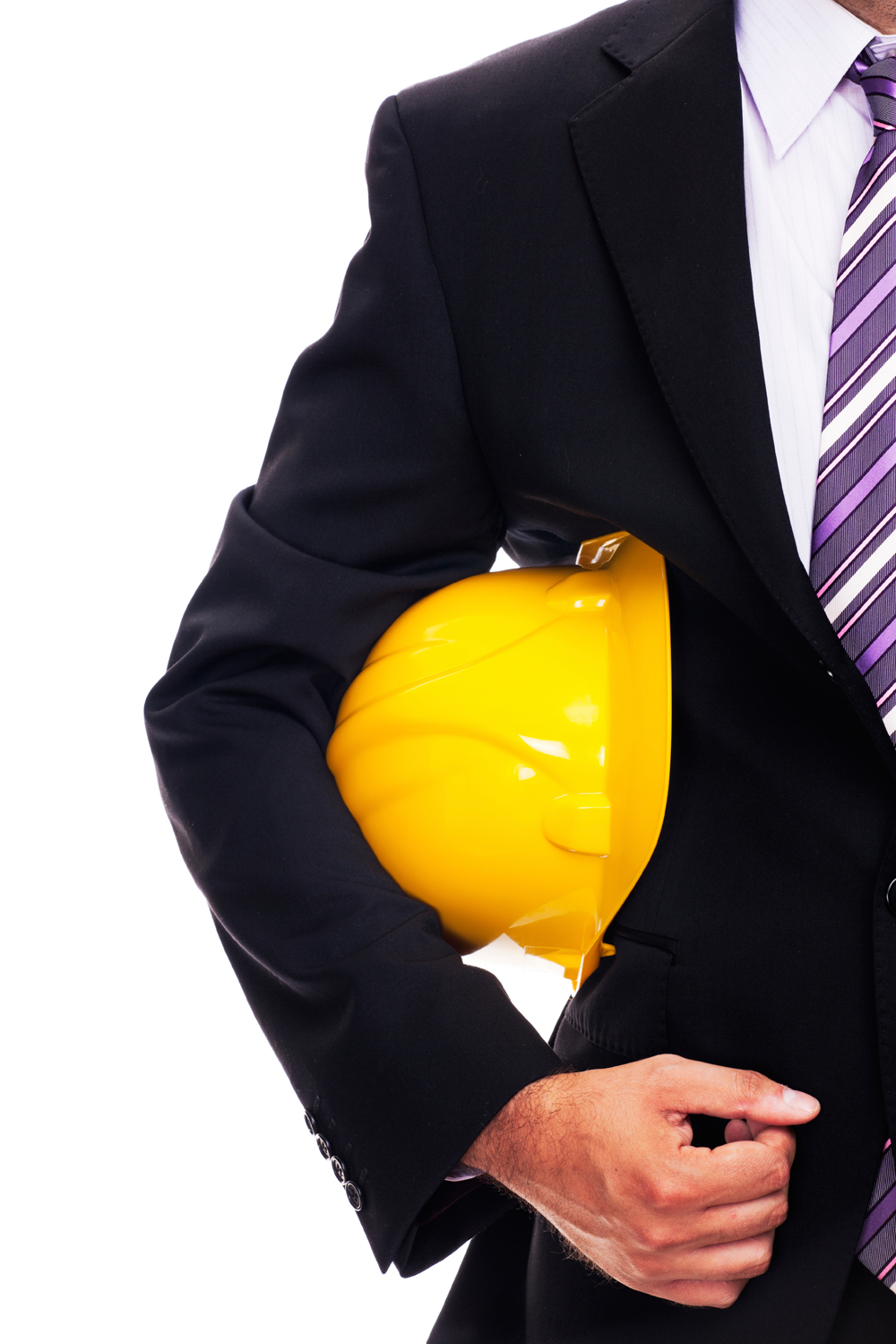 Businessman holding hard hat