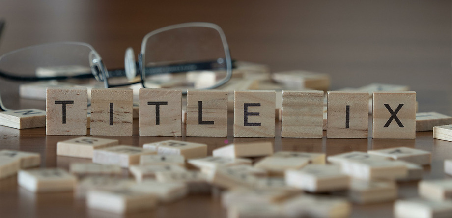 Title IX scrabble tiles on table