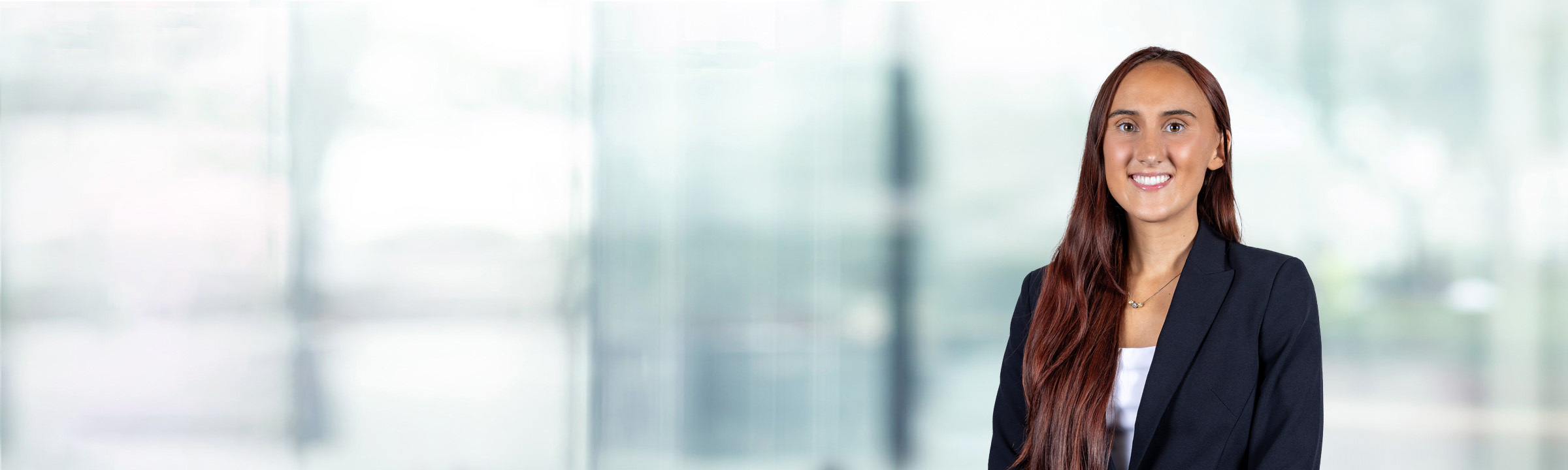 Ava Horgan on light blue and white bokeh banner