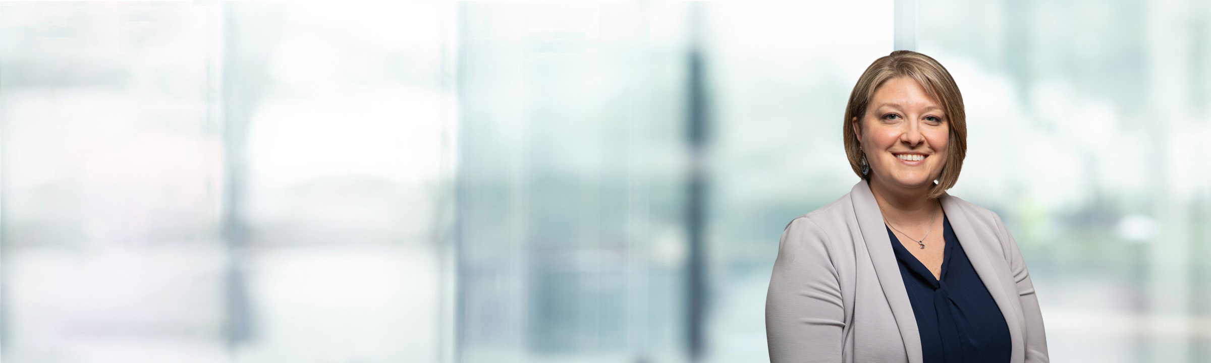 Sara Moretta on light blue and white bokeh banner