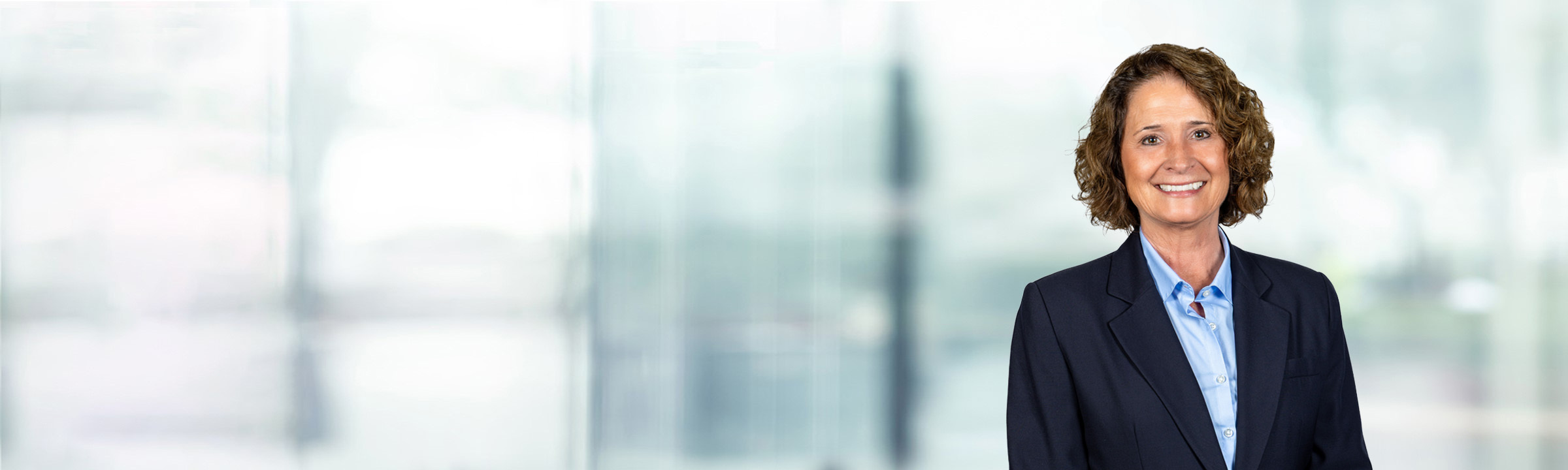 Amy Fitch on light blue and white bokeh banner