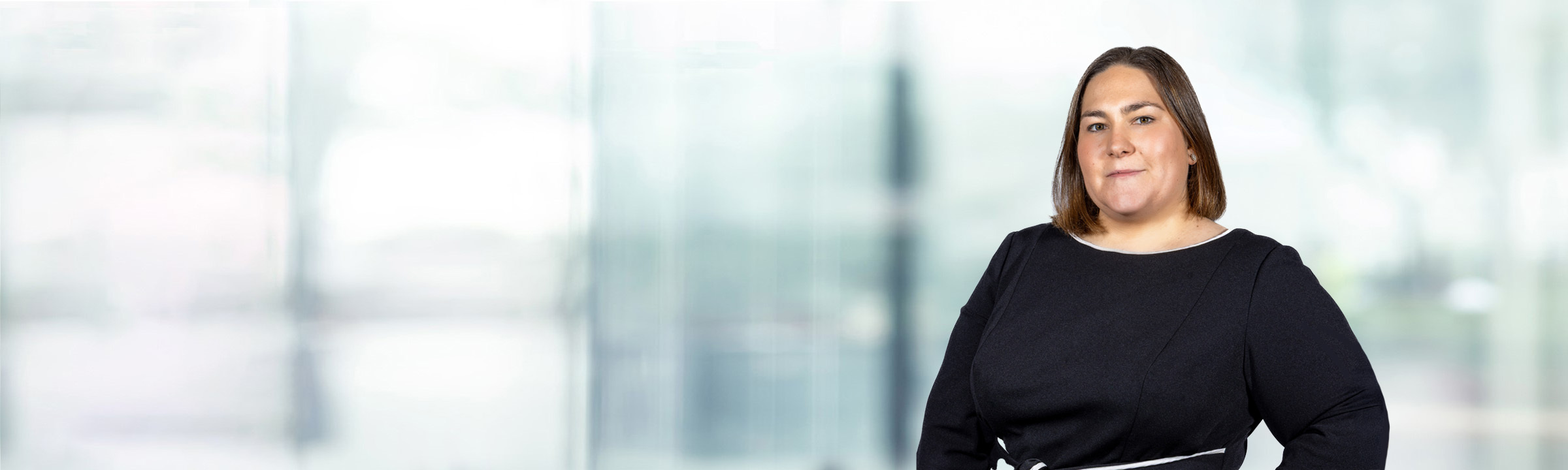 Kinsey O'Brien on light blue and white bokeh banner