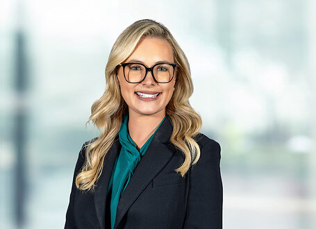 Jenna Rackerby on light blue and white bokeh banner