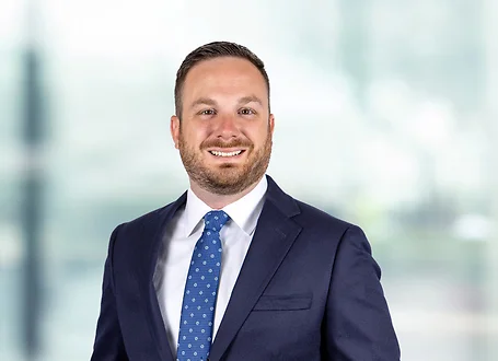 Bryan Carlo on light blue and white bokeh banner