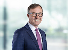 Jeff Stravino on light blue and white bokeh banner