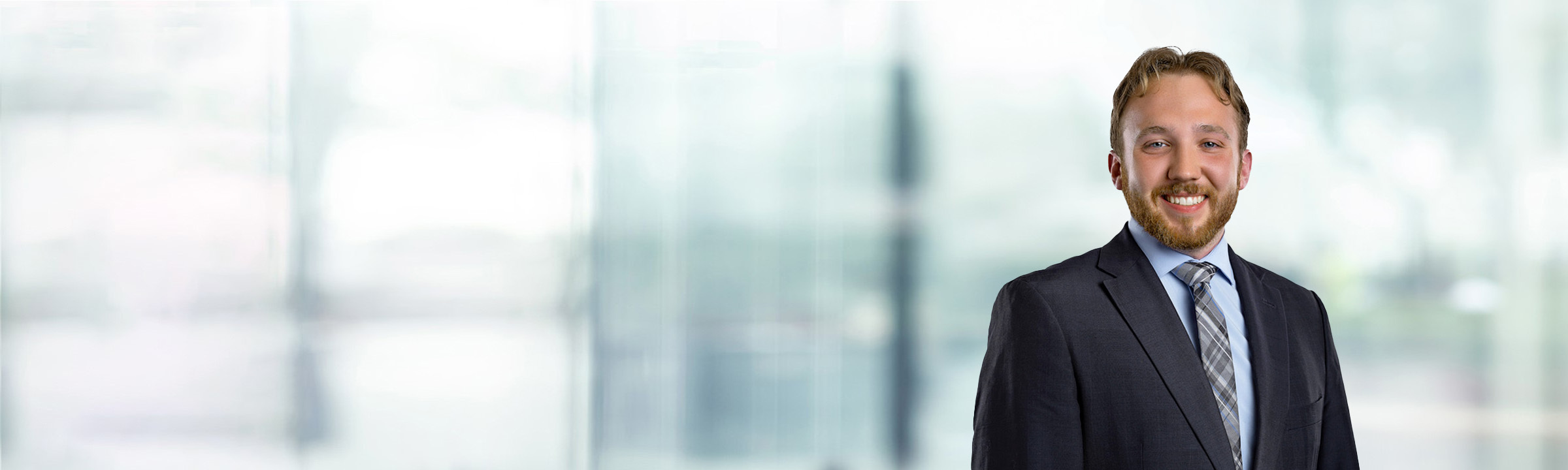 Andrew Cegielski on light blue and white bokeh banner