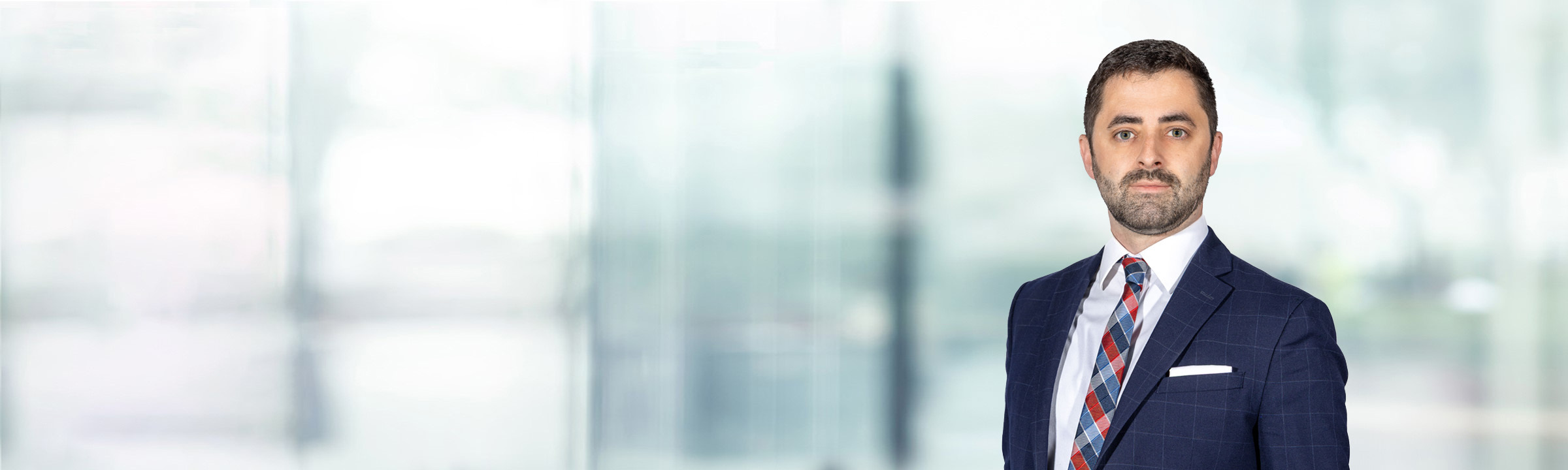 David Panzarella on light blue and white bokeh banner