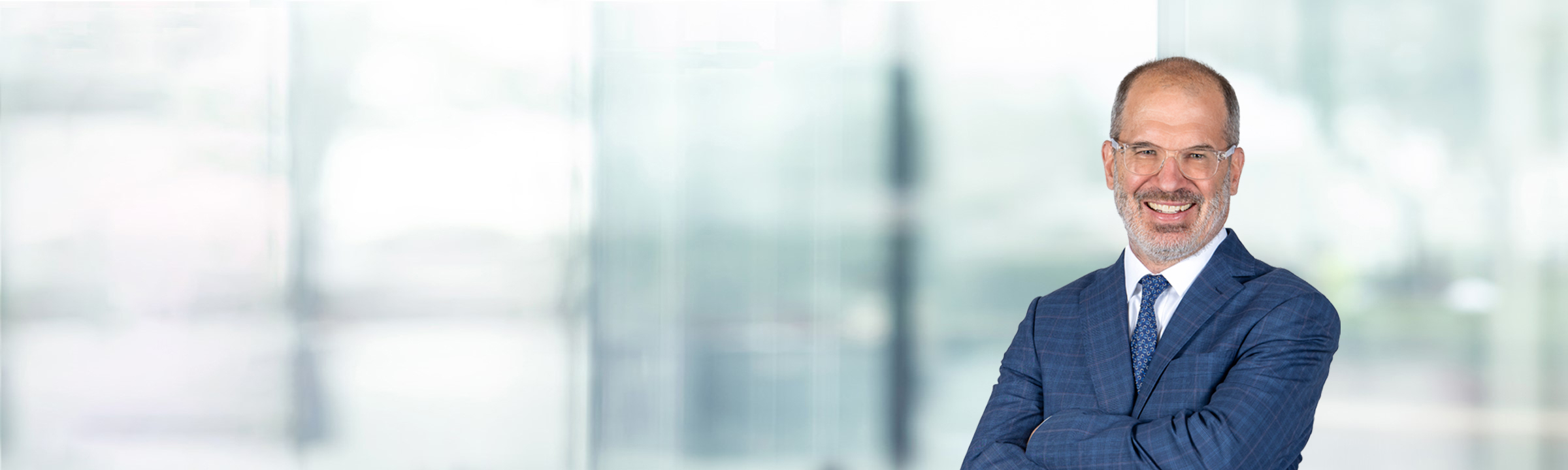 Thomas Berkman on light blue and white bokeh banner