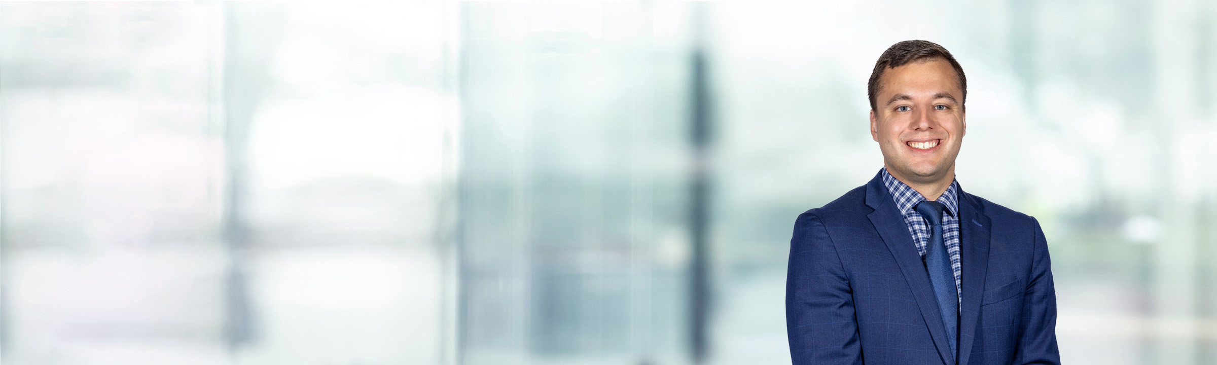 Benjamin Clark on light blue and white bokeh banner