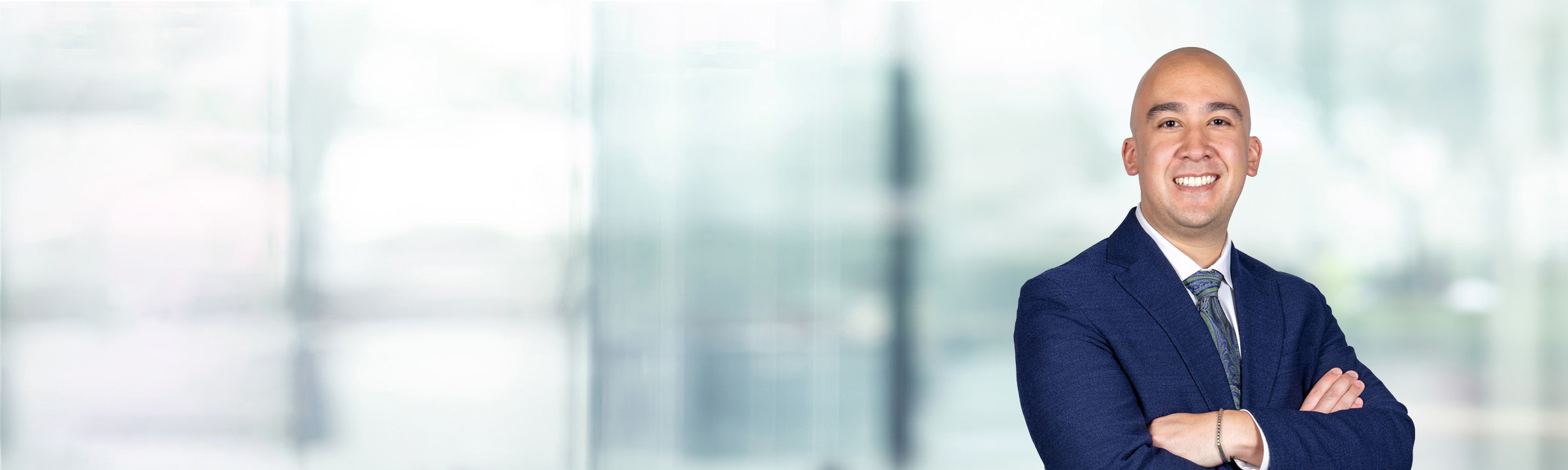 Joseph Bolognese on light blue and white bokeh banner