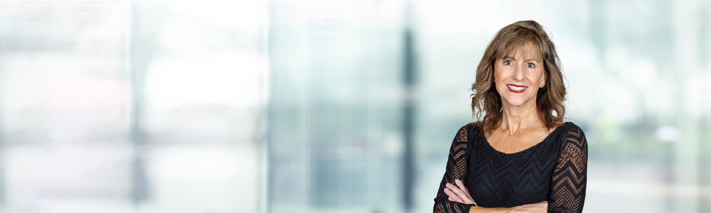 Carol Fitzsimmons on light blue and white bokeh banner