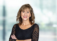 Carol Fitzsimmons on light blue and white bokeh banner