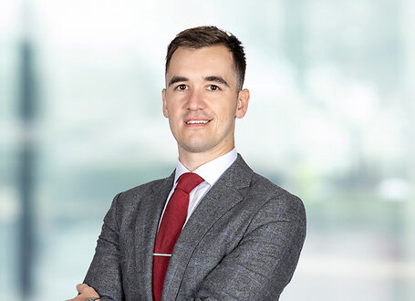 Bryce Kelly on light blue and white bokeh banner