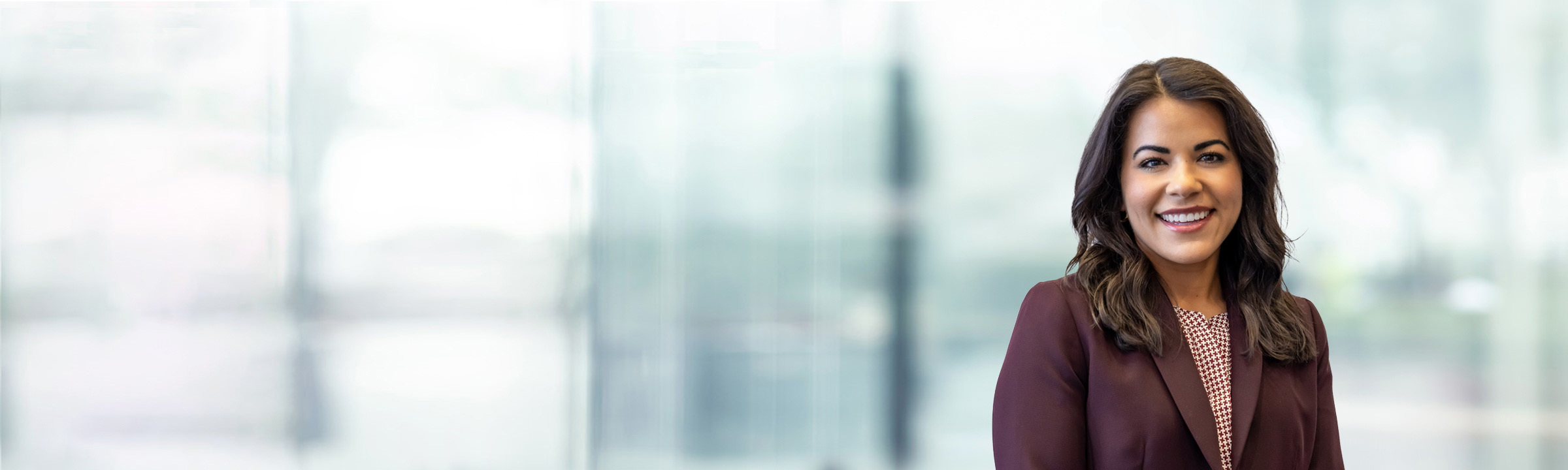 Jennifer Gonzalez on light blue and white bokeh banner