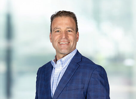 Christian Soller on light blue and white bokeh banner