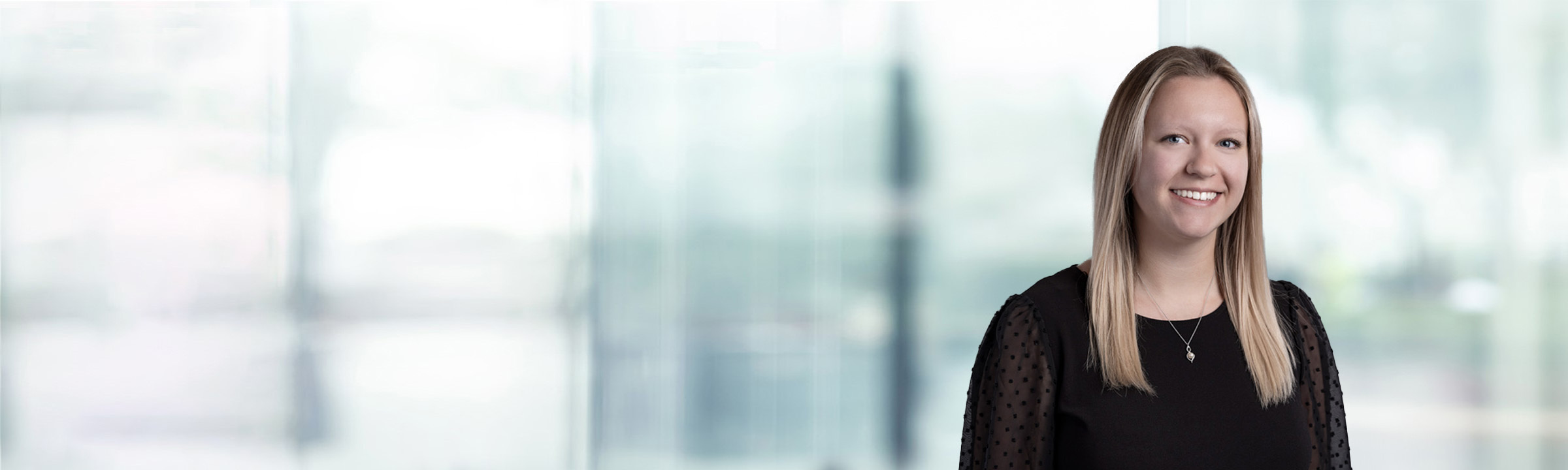 Amanda Sauciunac on light blue and white bokeh banner