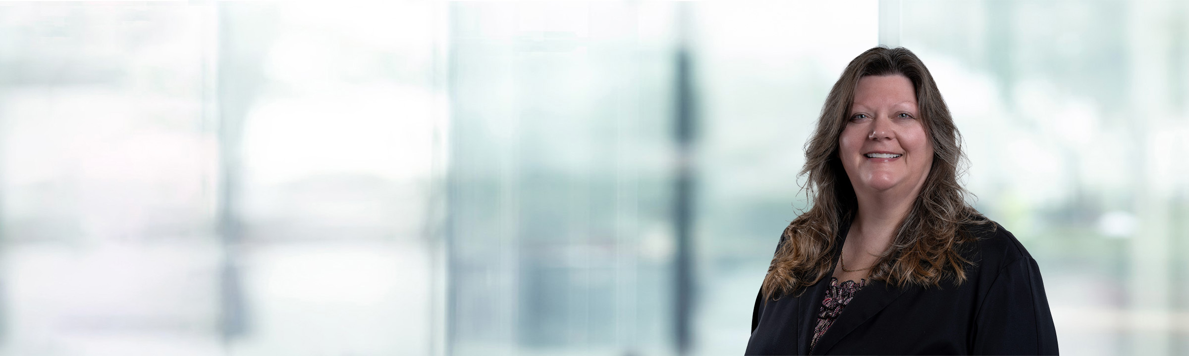 Annmarie Staniszewski on light blue and white bokeh banner