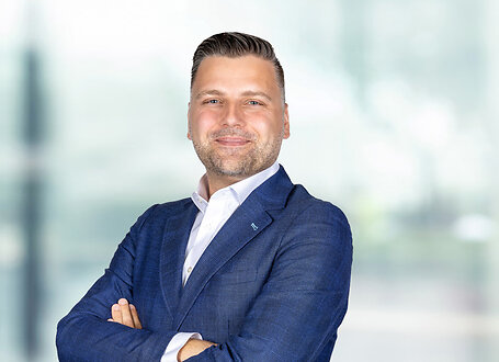 Danijel Augustinovic on light blue and white bokeh banner