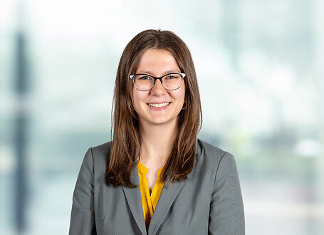 Madeline Miller on light blue and white bokeh banner