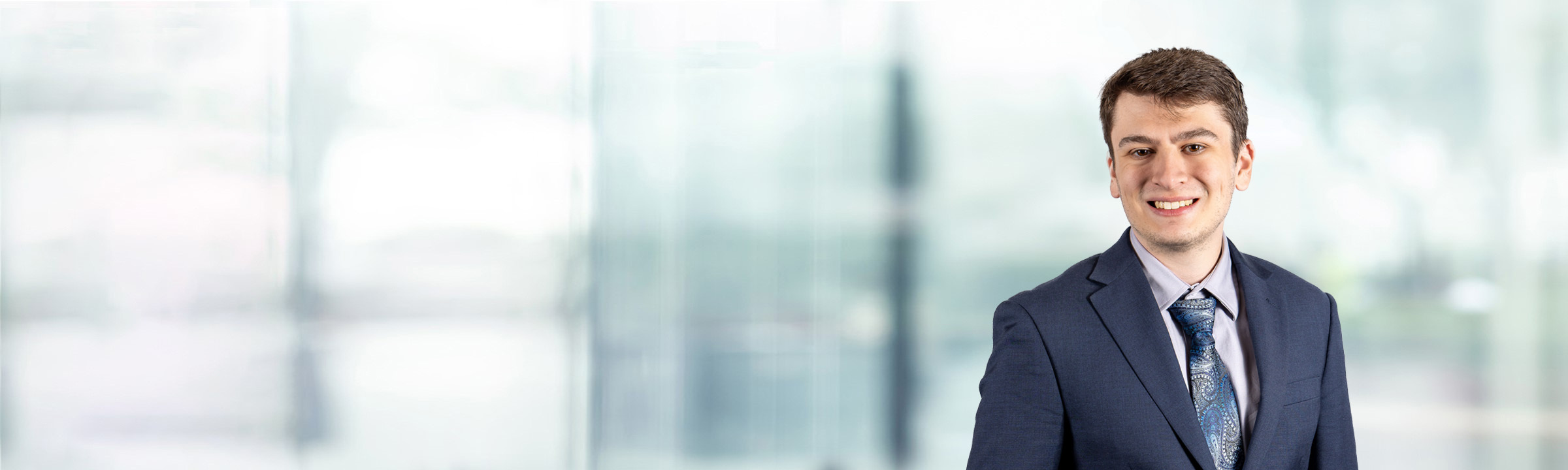 Zachary Anne on light blue and white bokeh banner