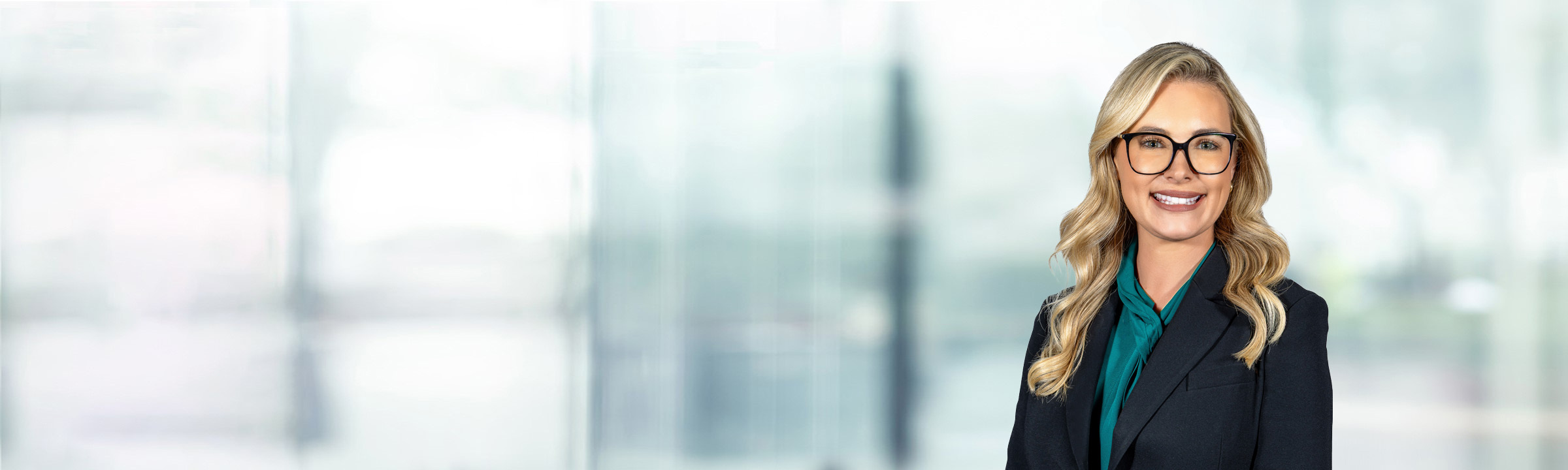 Jenna Rackerby on light blue and white bokeh banner