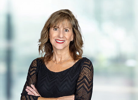 Carol Fitzsimmons on light blue and white bokeh banner