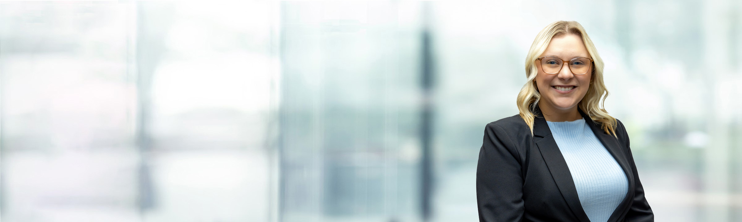 Kristen Mowery on light blue and white bokeh banner