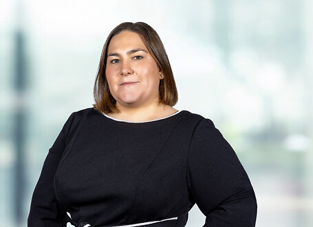 Kinsey O'Brien on light blue and white bokeh banner