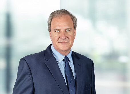 Nicholas Gatto on light blue and white bokeh banner