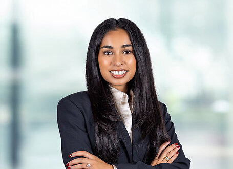 Rani Patel on light blue and white bokeh banner