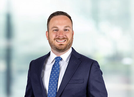 Bryan Carlo on light blue and white bokeh banner