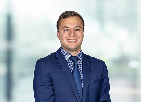 Benjamin Clark on light blue and white bokeh banner