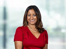 Reetuparna Dutta on light blue and white bokeh banner