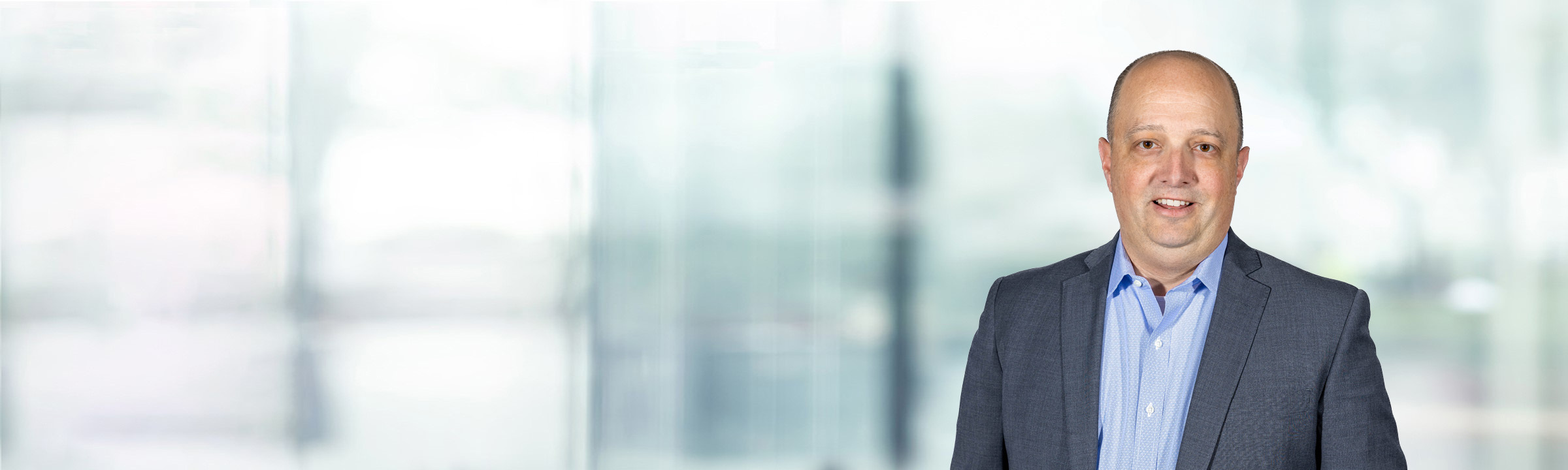 Benjamin Farber on light blue and white bokeh banner