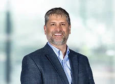 Christopher Canada on light blue and white bokeh banner