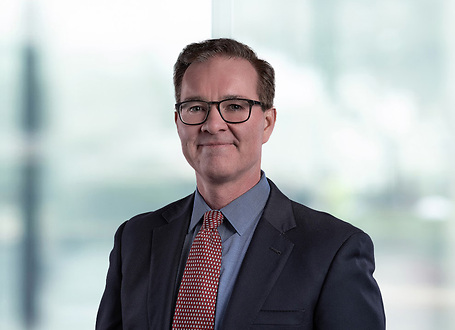 David Reed on light blue and white bokeh banner