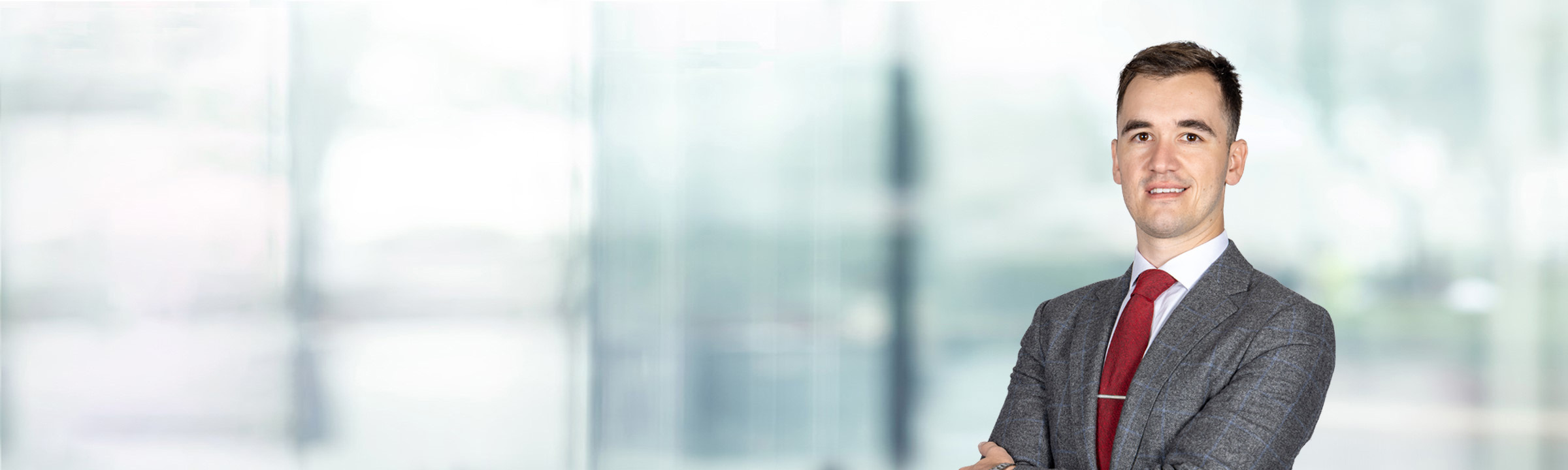 Bryce Kelly on light blue and white bokeh banner