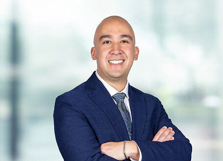 Joseph Bolognese on light blue and white bokeh banner