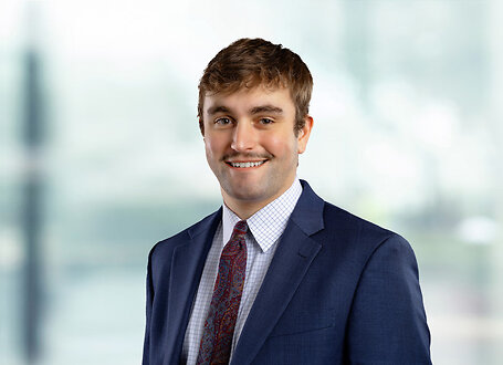 Noah Chase on light blue and white bokeh banner