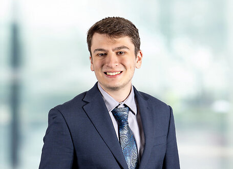 Zachary Anne on light blue and white bokeh banner