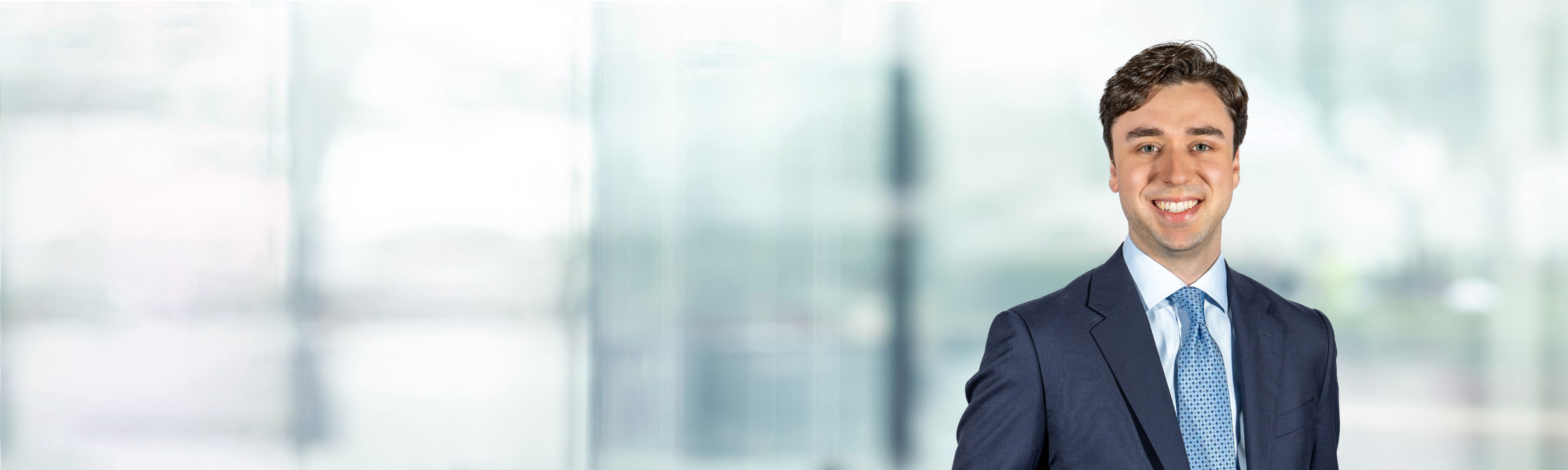 Peter Calleri on light blue and white bokeh banner