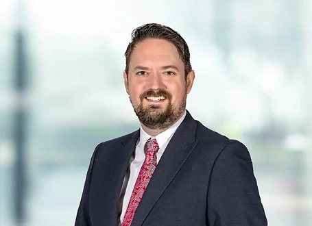 David Wilks on light blue and white bokeh banner