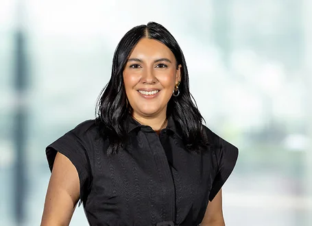 Andrea Rojas on light blue and white bokeh banner