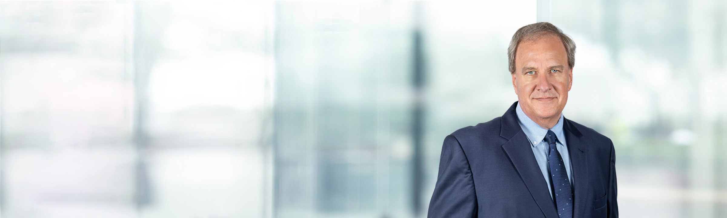 Nicholas Gatto on light blue and white bokeh banner