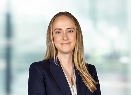 Claire Wells on light blue and white bokeh banner