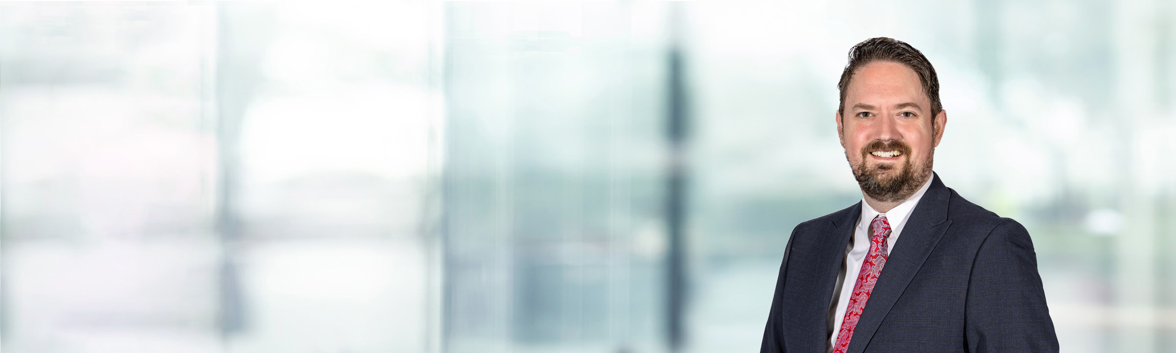 David Wilks on light blue and white bokeh banner