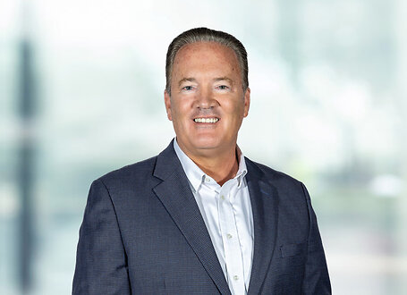 Jeffrey Swiatek on light blue and white bokeh banner